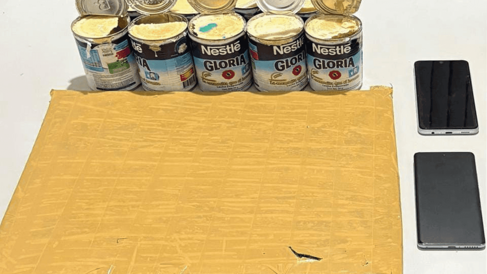 Parte da droga estava escondida em latas de creme de leite